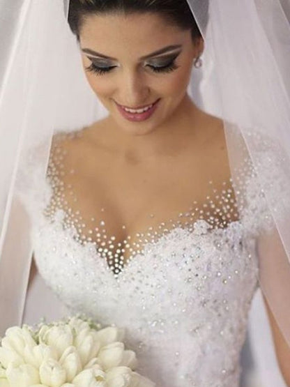 Ball Gown Sleeveless V-neck Beading Floor-Length Tulle Wedding Dresses